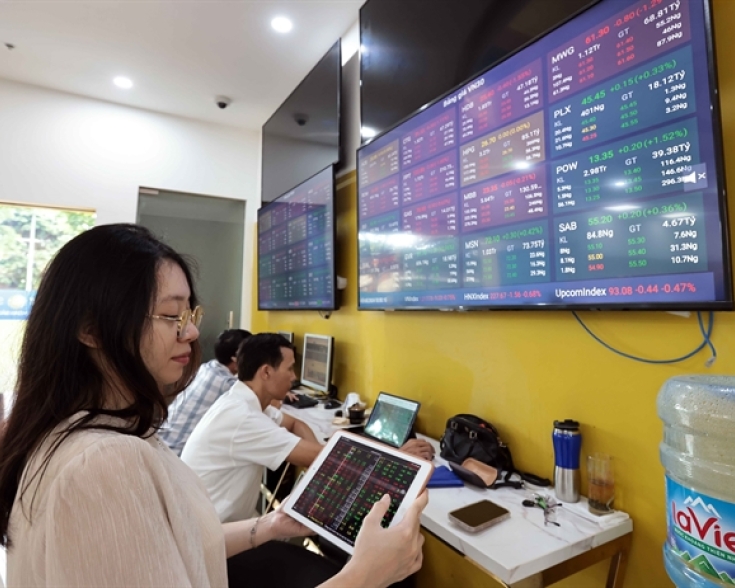 Investors tracking the market's movements on a trading floor